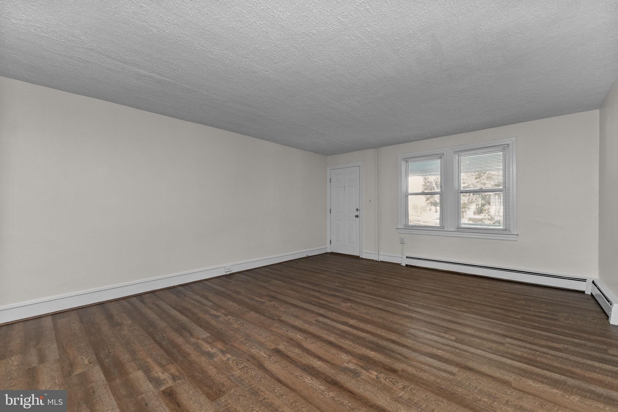 333 Union Street Hatfield, PA 19440 - Photo 5 of 35 a view of an empty room with wooden floor and window