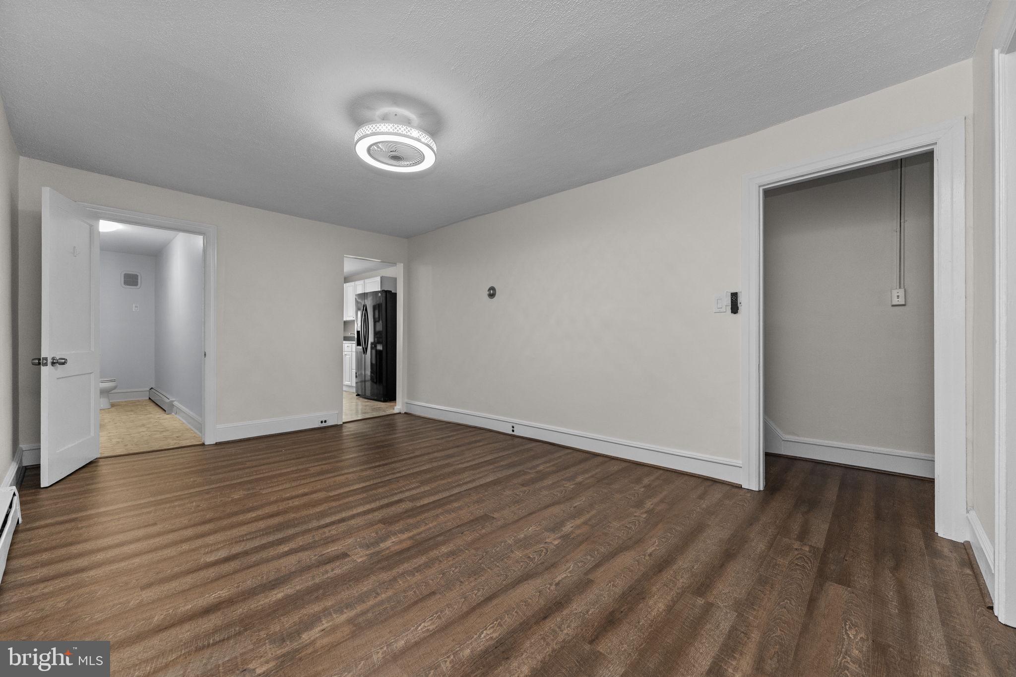 333 Union Street Hatfield, PA 19440 - Photo 8 of 35 a view of an empty room with wooden floor and a window