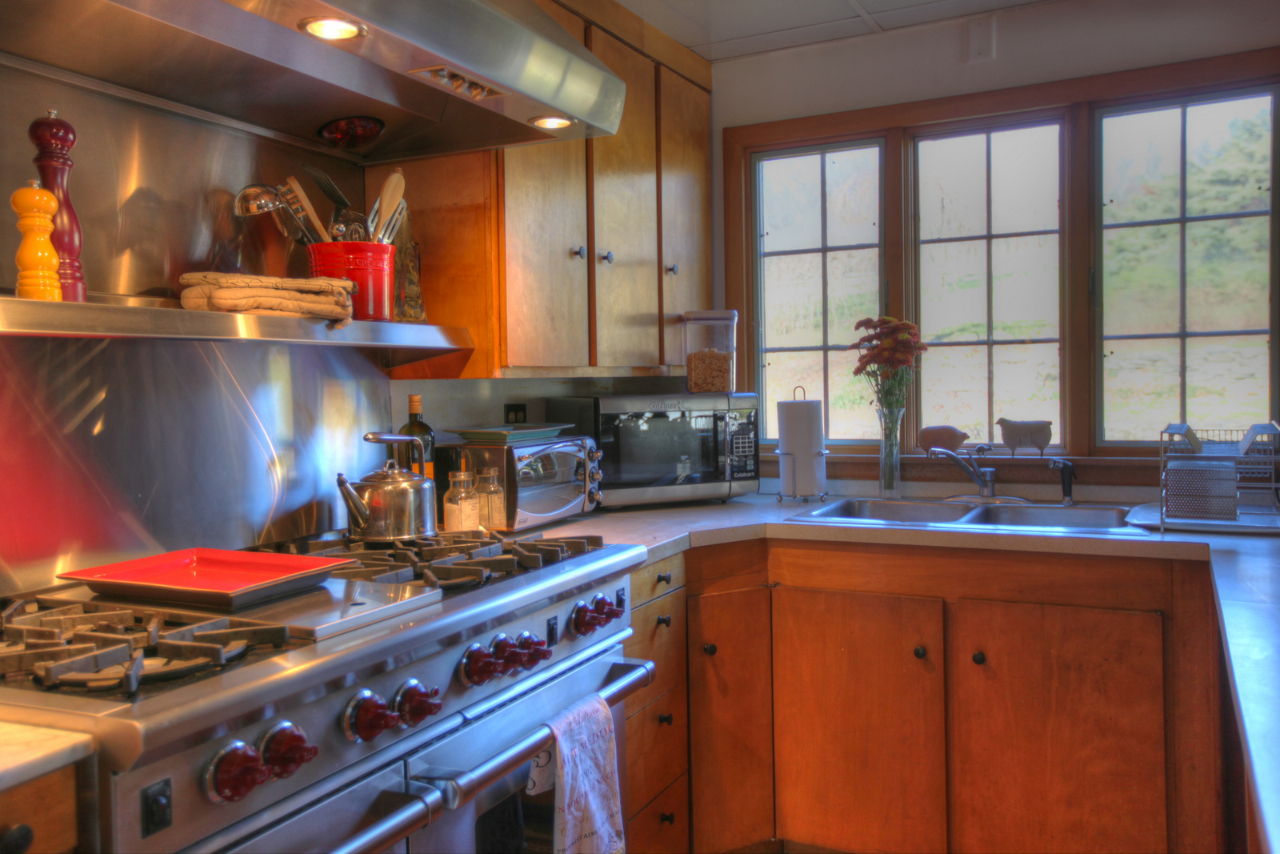 171 Main Road Monterey, MA 01230 - Photo 11 of 42 a kitchen with stainless steel appliances granite countertop a stove and a sink