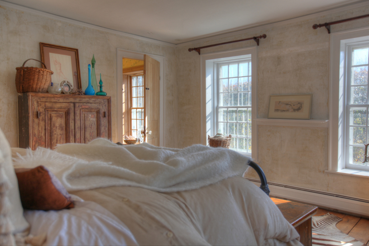 171 Main Road Monterey, MA 01230 - Photo 26 of 42 a bed sitting in a bedroom next to a window