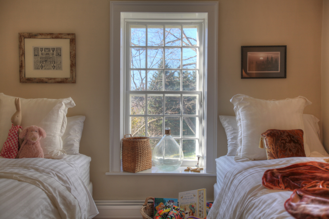 171 Main Road Monterey, MA 01230 - Photo 28 of 42 a bed sitting in a bedroom next to a window