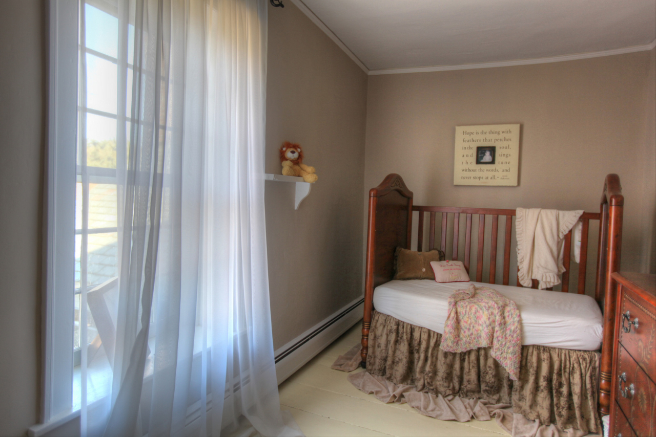 171 Main Road Monterey, MA 01230 - Photo 32 of 42 a bedroom with a bed and wooden floor