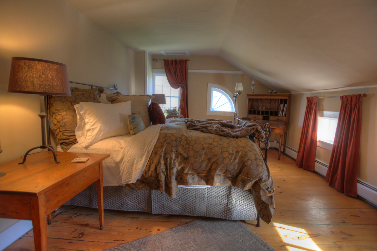 171 Main Road Monterey, MA 01230 - Photo 33 of 42 a bed room with a bed and a night stand