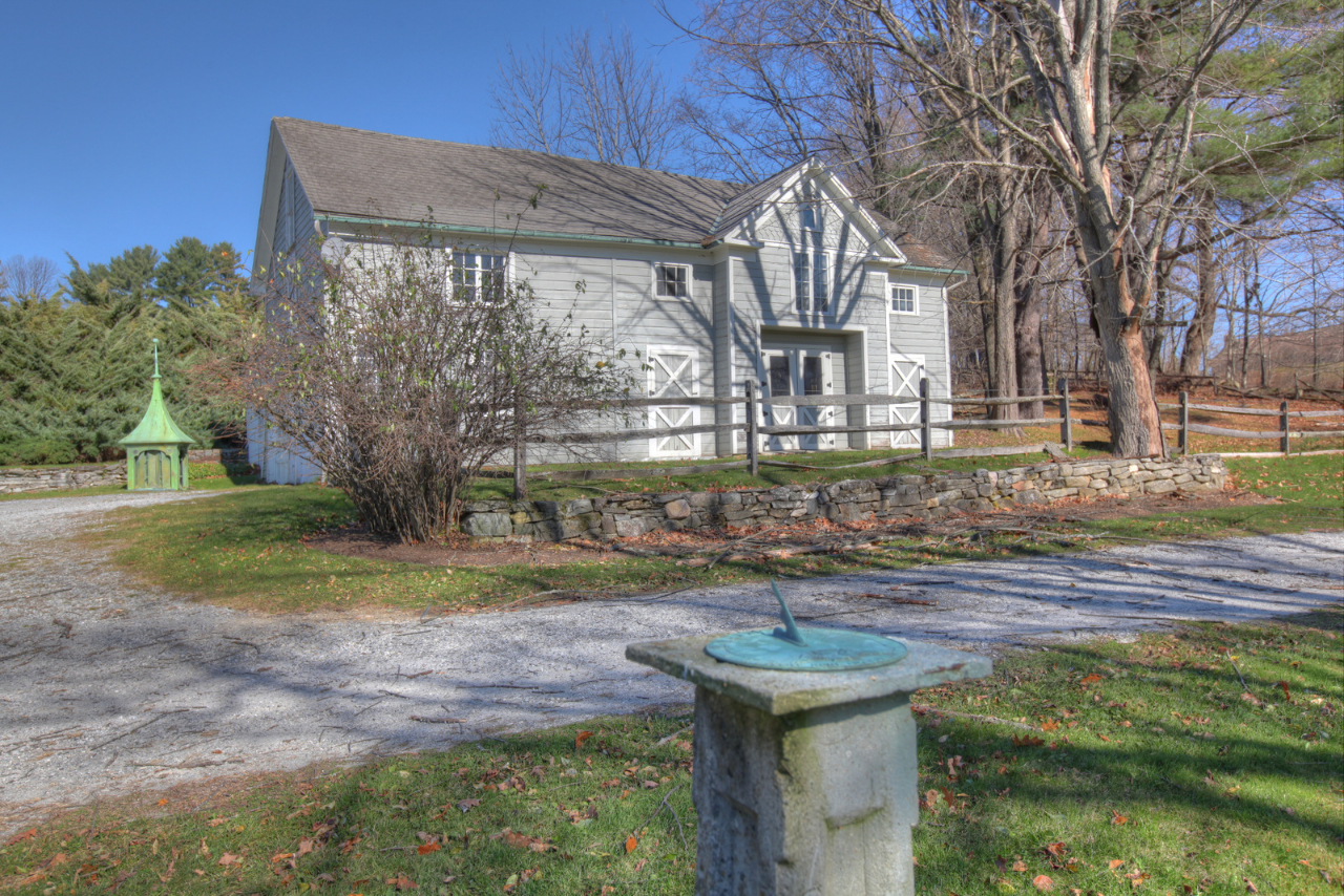 171 Main Road Monterey, MA 01230 - Photo 5 of 42 a front view of a house with garden