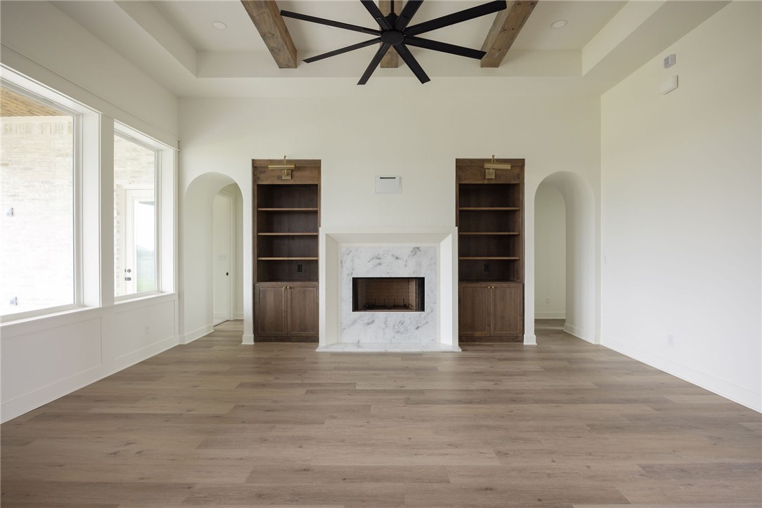 6697 Ridgeview Estates Lane Bryan, TX 77808 - Photo 11 of 31 a view of an empty room with wooden floor and a window