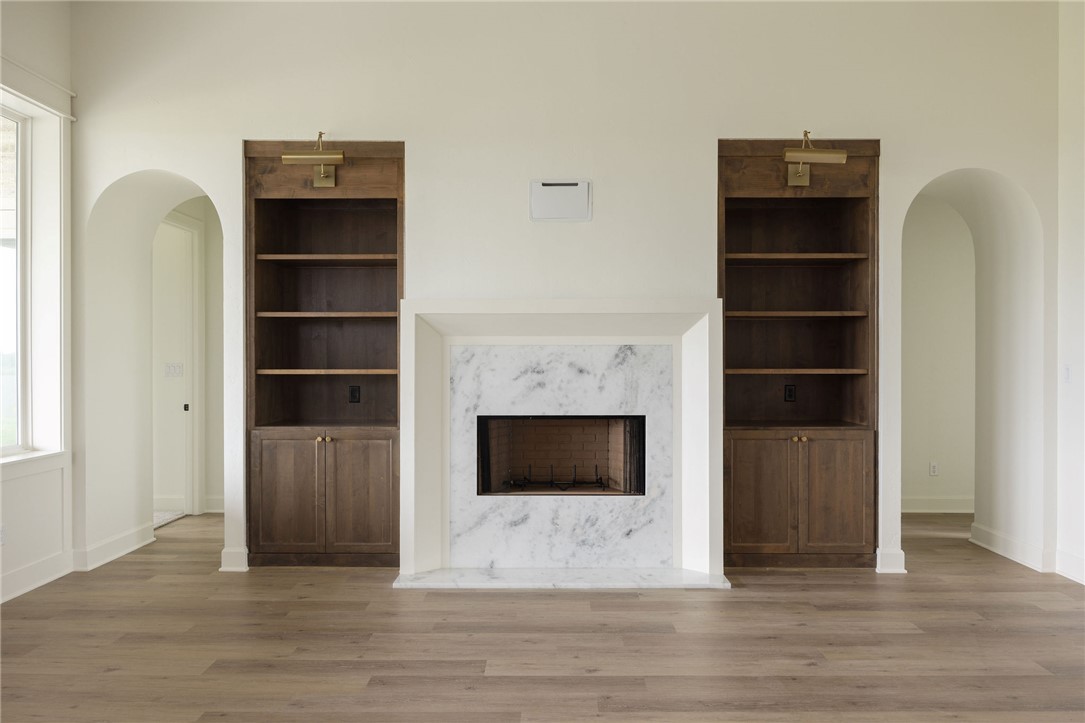 6697 Ridgeview Estates Lane Bryan, TX 77808 - Photo 12 of 31 a living room with a fireplace and a walk in closet
