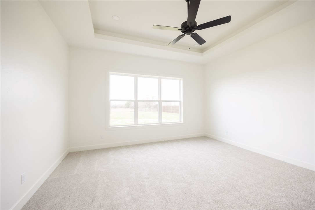 6697 Ridgeview Estates Lane Bryan, TX 77808 - Photo 17 of 31 an empty room with a window and a fan