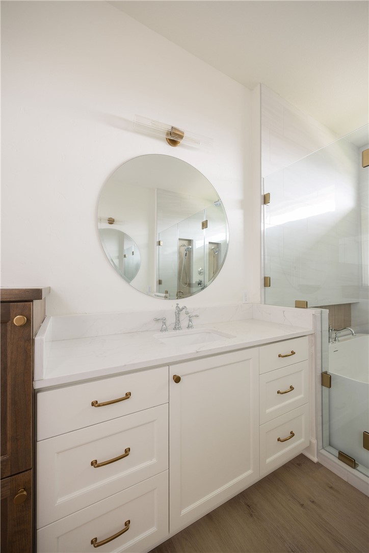 6697 Ridgeview Estates Lane Bryan, TX 77808 - Photo 23 of 31 a bathroom with a double vanity sink and mirror