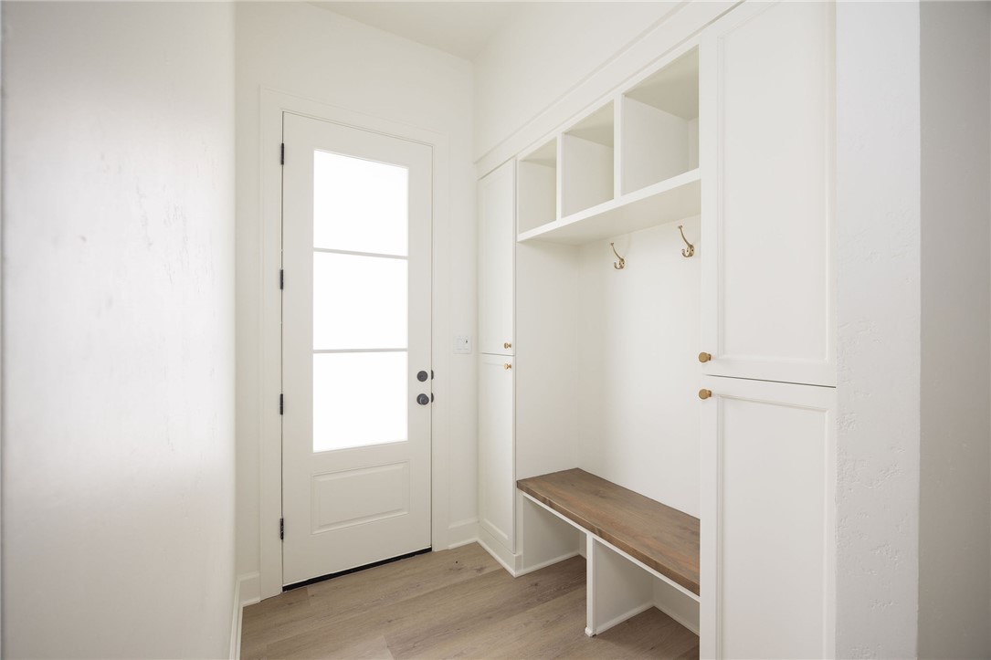 6697 Ridgeview Estates Lane Bryan, TX 77808 - Photo 25 of 31 a view of a room with wooden floor and white walls