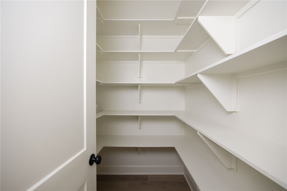6697 Ridgeview Estates Lane Bryan, TX 77808 - Photo 26 of 31 a view of walk in closet with empty racks
