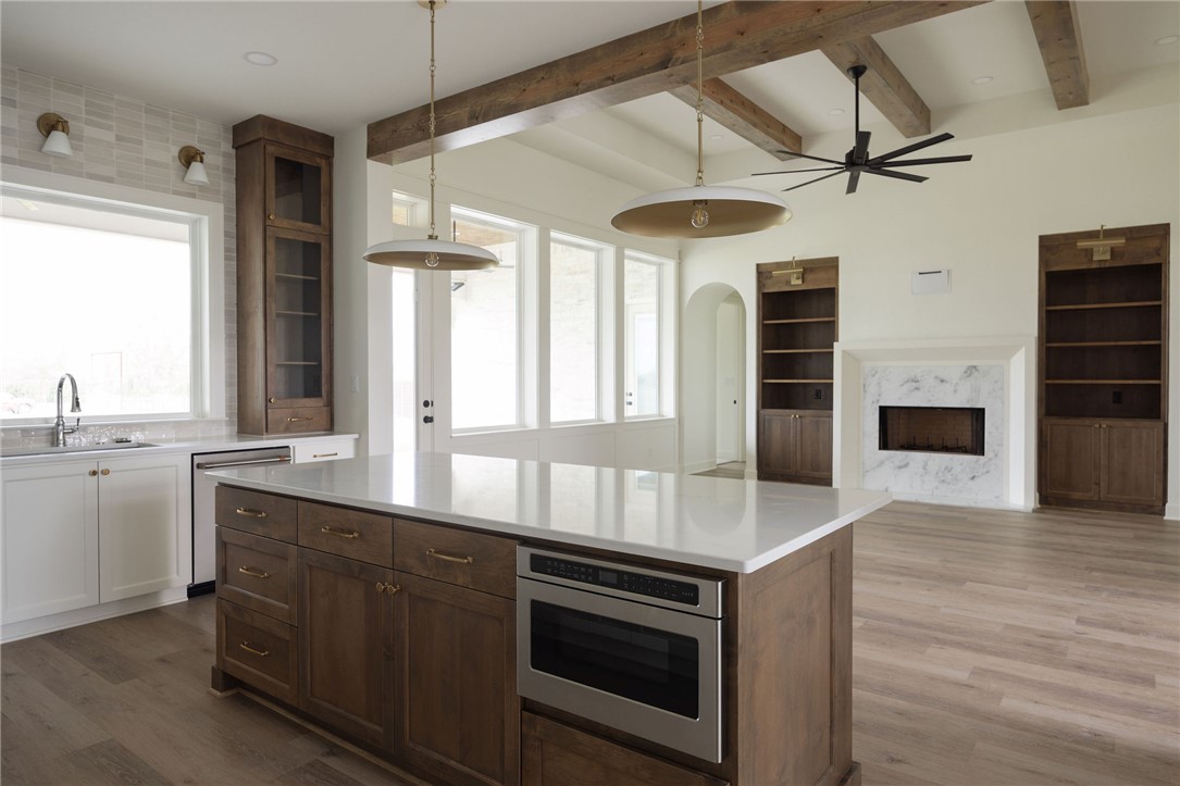 6697 Ridgeview Estates Lane Bryan, TX 77808 - Photo 9 of 31 a kitchen with stainless steel appliances granite countertop a stove and a sink