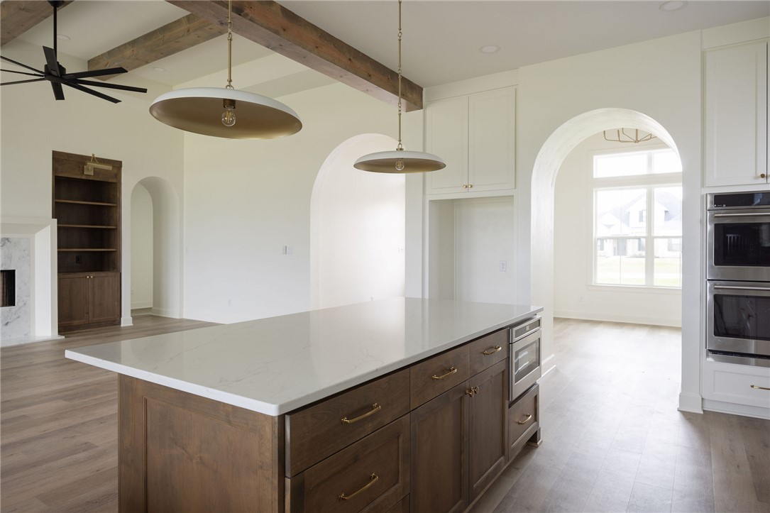 6697 Ridgeview Estates Lane Bryan, TX 77808 - Photo 10 of 31 a kitchen with a fridge a stove and a window