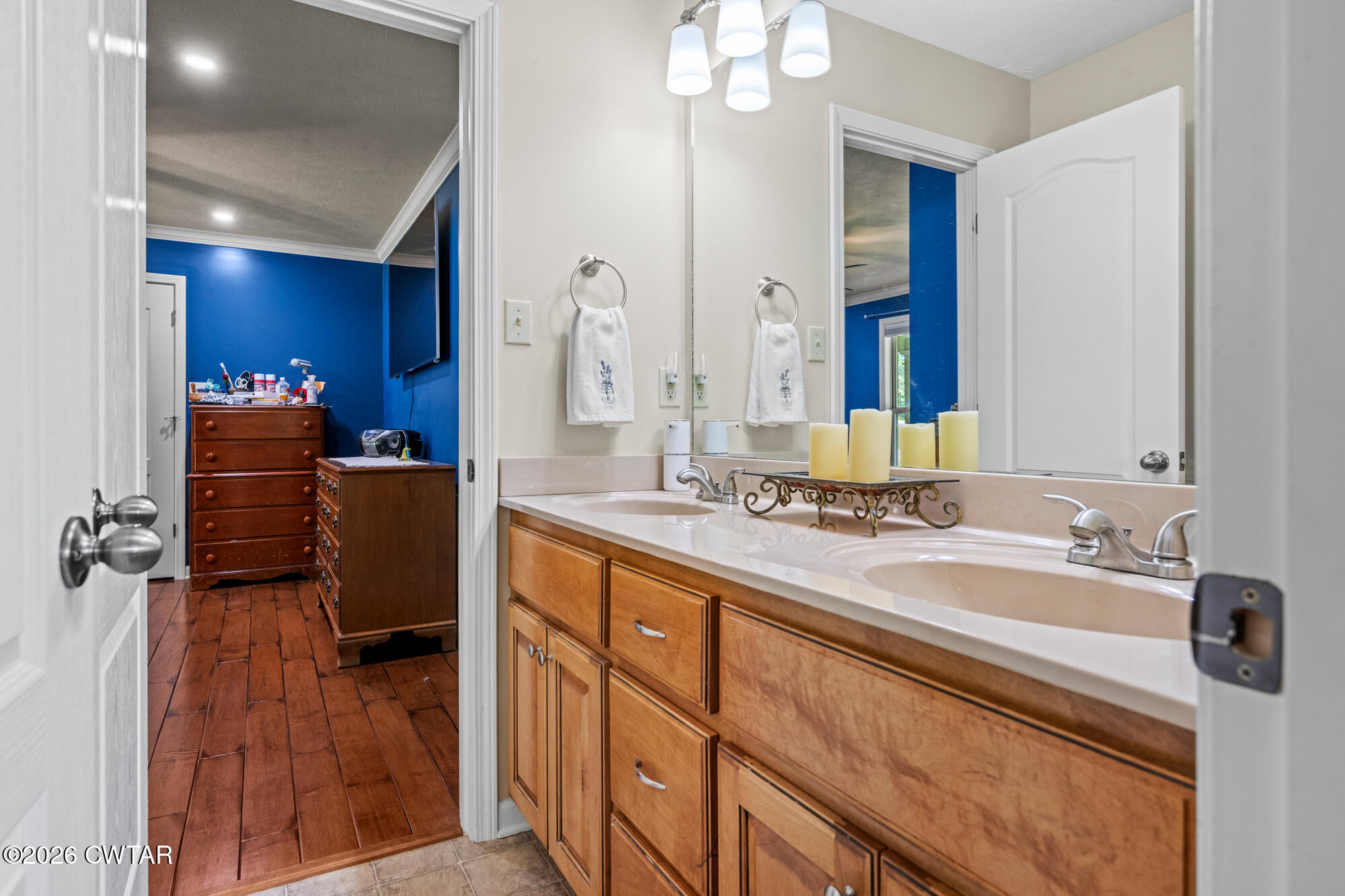 492 Joe Horton Road Lexington, TN 38351 - Photo 27 of 49 a bathroom with double vanity sink and a mirror