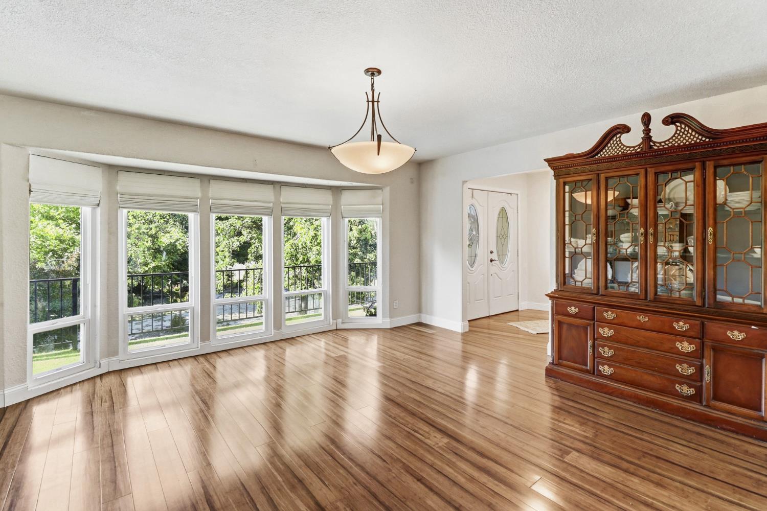 4330 Cavitt Stallman Road Granite Bay, CA 95746 - Photo 12 of 85 a view of empty room with wooden floor and fan