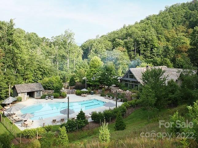 2919 Preserve Road, Unit 103 Sylva, NC 28779 - Photo 12 of 18 a backyard of a house with lots of green space