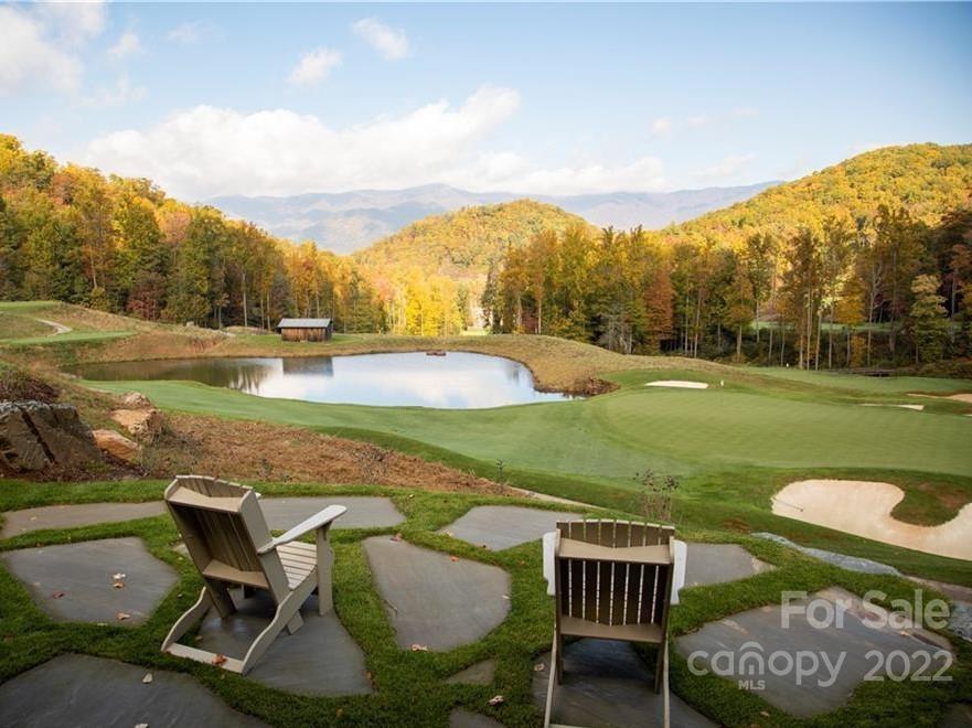 2919 Preserve Road, Unit 103 Sylva, NC 28779 - Photo 18 of 18 a view of a swimming pool and lounge chairs