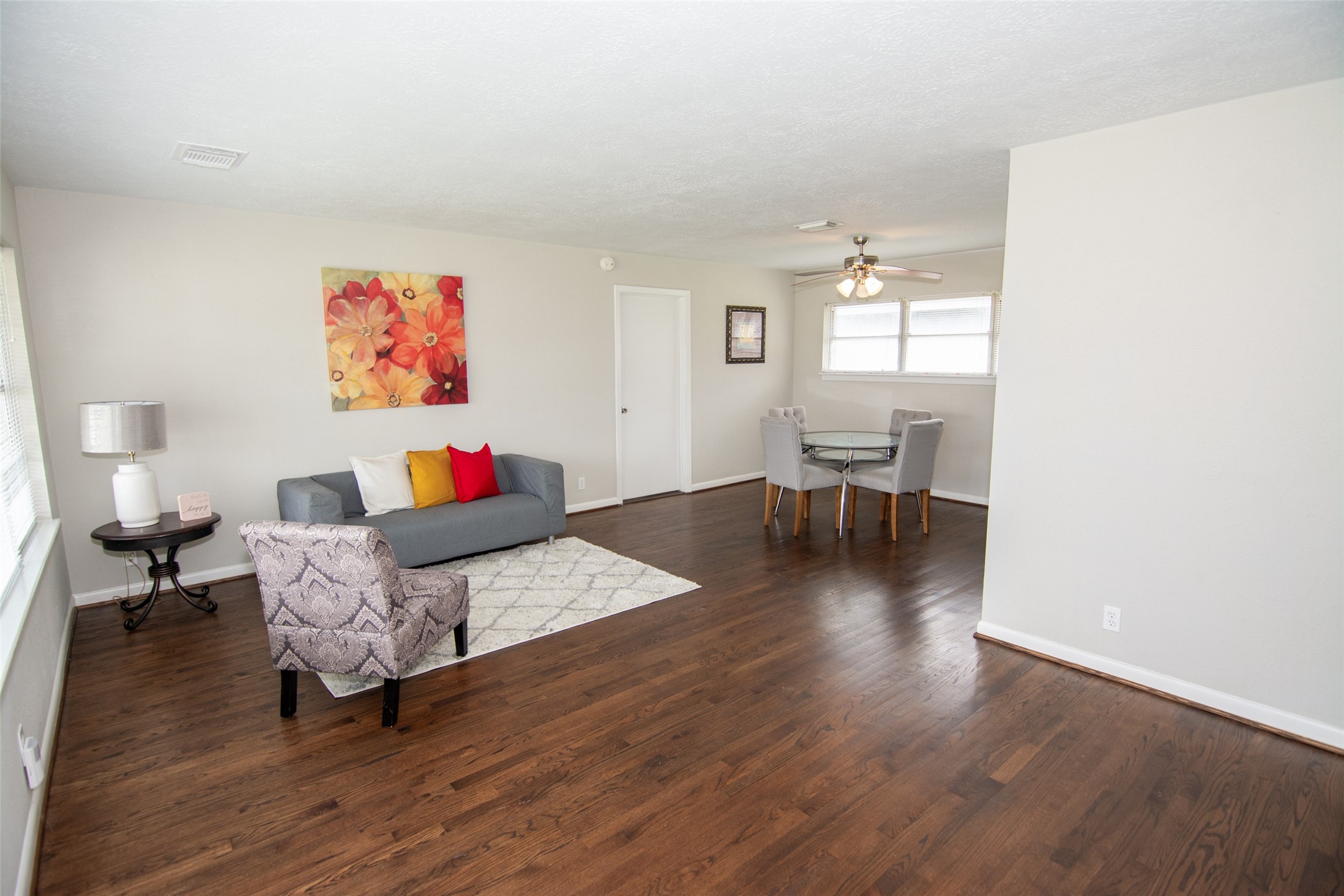 103 East Janisch Road Houston, TX 77022 - Photo 8 of 18 a living room with furniture and a wooden floor
