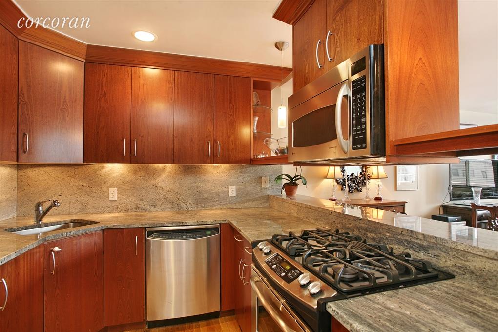 a kitchen with wooden cabinets and a stove top oven