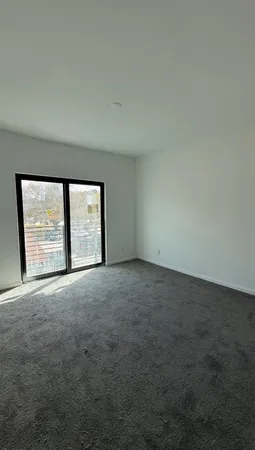 an empty room with a large window