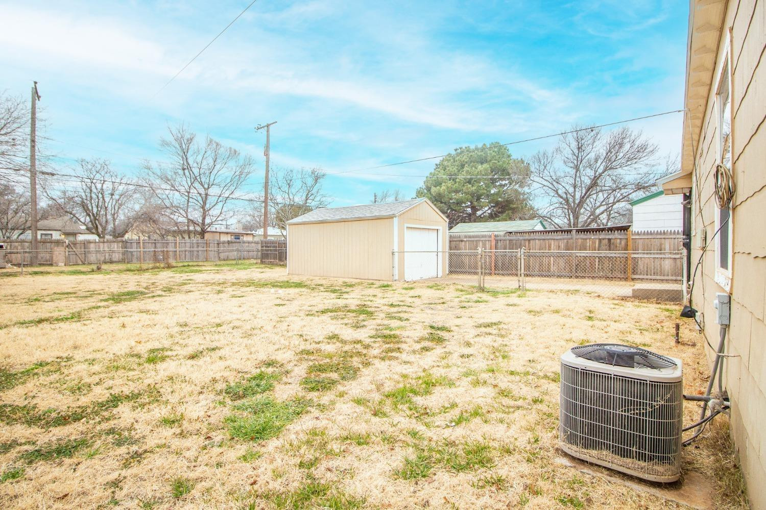 2715 36th Street Lubbock, TX 79413 - Photo 14 of 14 a view of swimming pool with a yard