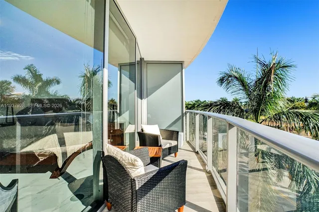 a view of balcony with furniture