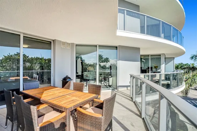 a dinning table and chairs in the balcony