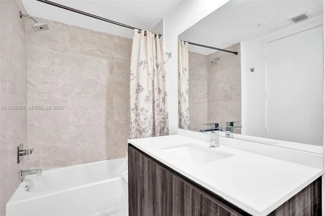 a bathroom with a sink and a bathtub