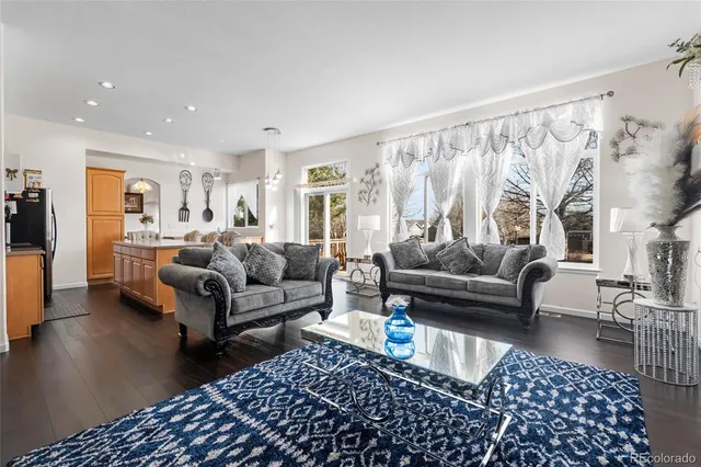 a living room with furniture and a rug