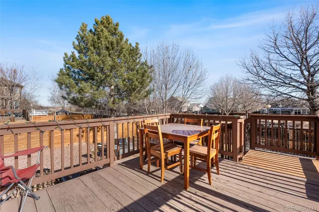 a view of a chairs on wooden deck