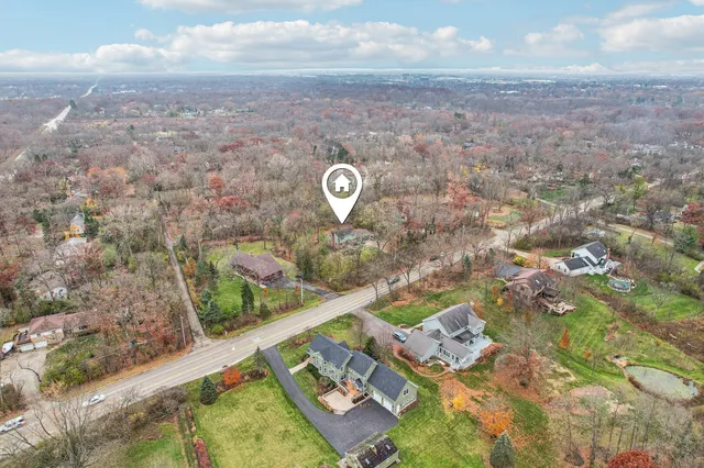 a aerial view of a house with a yard
