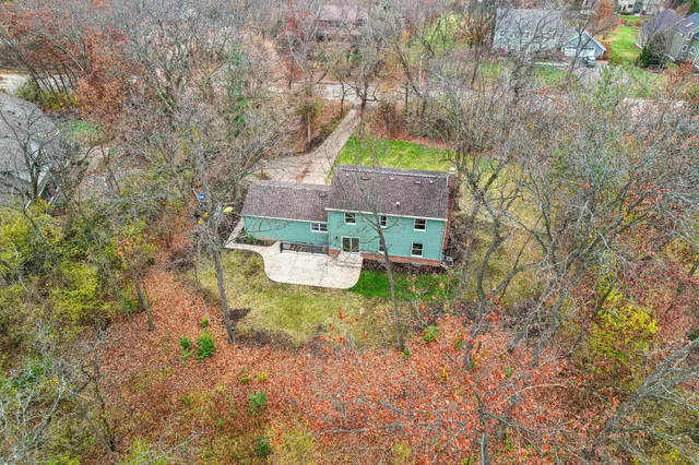 a aerial view of a house with a yard