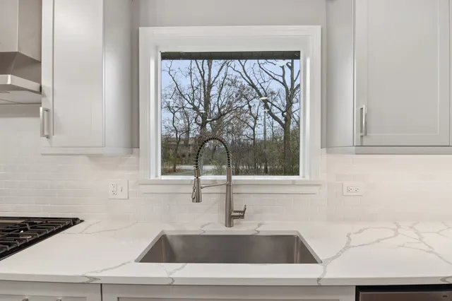 a kitchen with a sink and a window