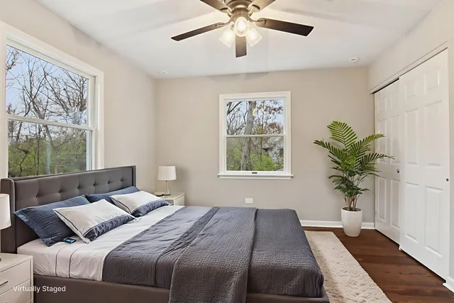 a bedroom with a large bed and a window