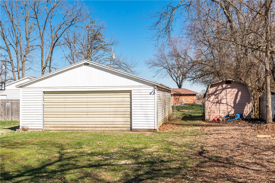5760 Kitridge Road Dayton, OH 45424 - Photo 15 of 19 This property features a detached garage and a storage shed, offering ample space for vehicles and belongings.