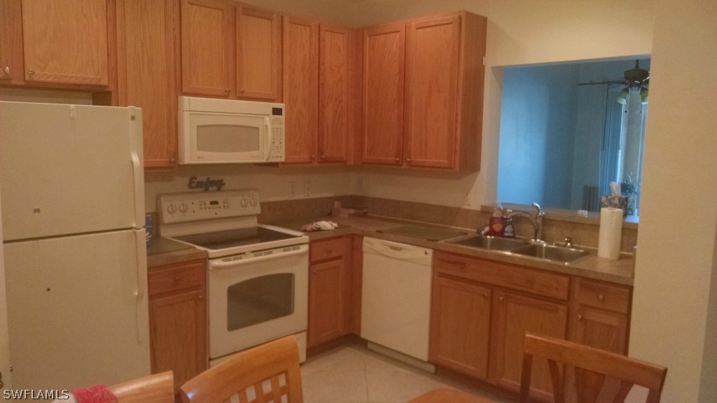 3957 Cherrybrook Loop Fort Myers, FL 33966 - Photo 3 of 6 a utility room with sink dryer and washer
