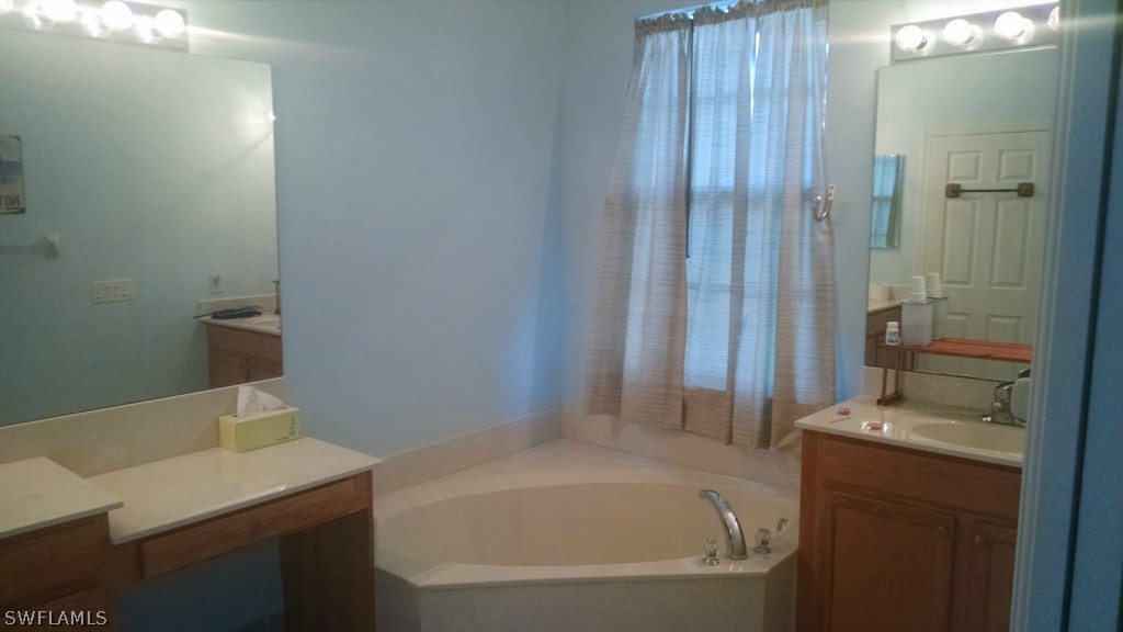 3957 Cherrybrook Loop Fort Myers, FL 33966 - Photo 5 of 6 a bathroom with a sink and a bathtub