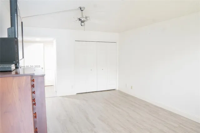 a view of a kitchen with wooden floor