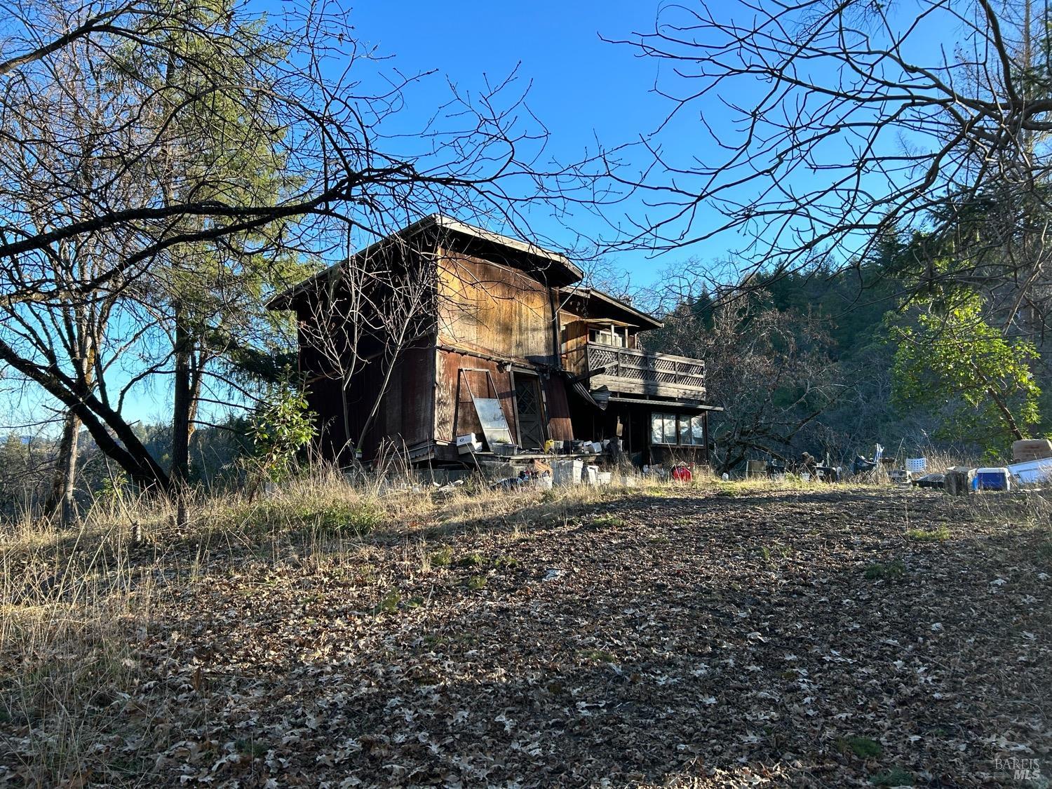9000 Spyrock Road Covelo, CA 95428 - Photo 16 of 33 a view of a house with a yard