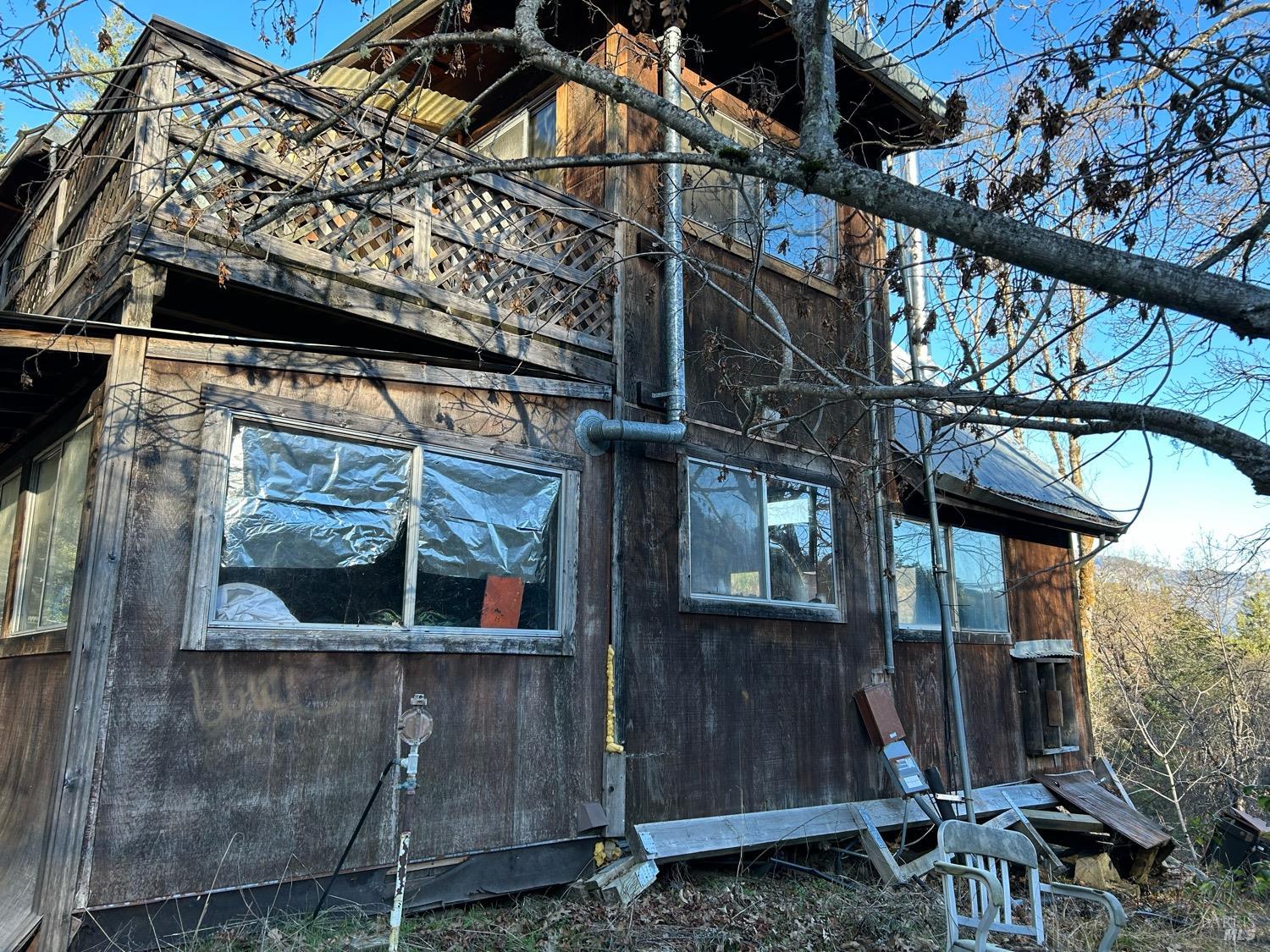 9000 Spyrock Road Covelo, CA 95428 - Photo 17 of 33 a front view of a house with a tree