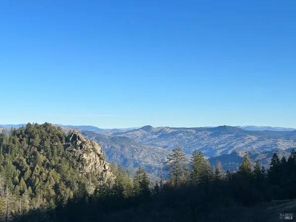 a view of mountains and valleys