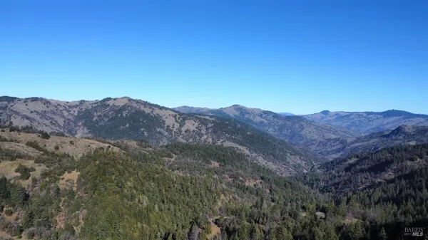 a view of mountains and valleys