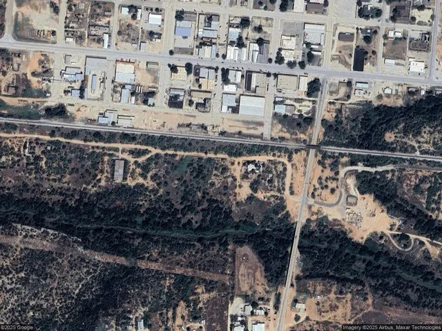 a view of building with large tree