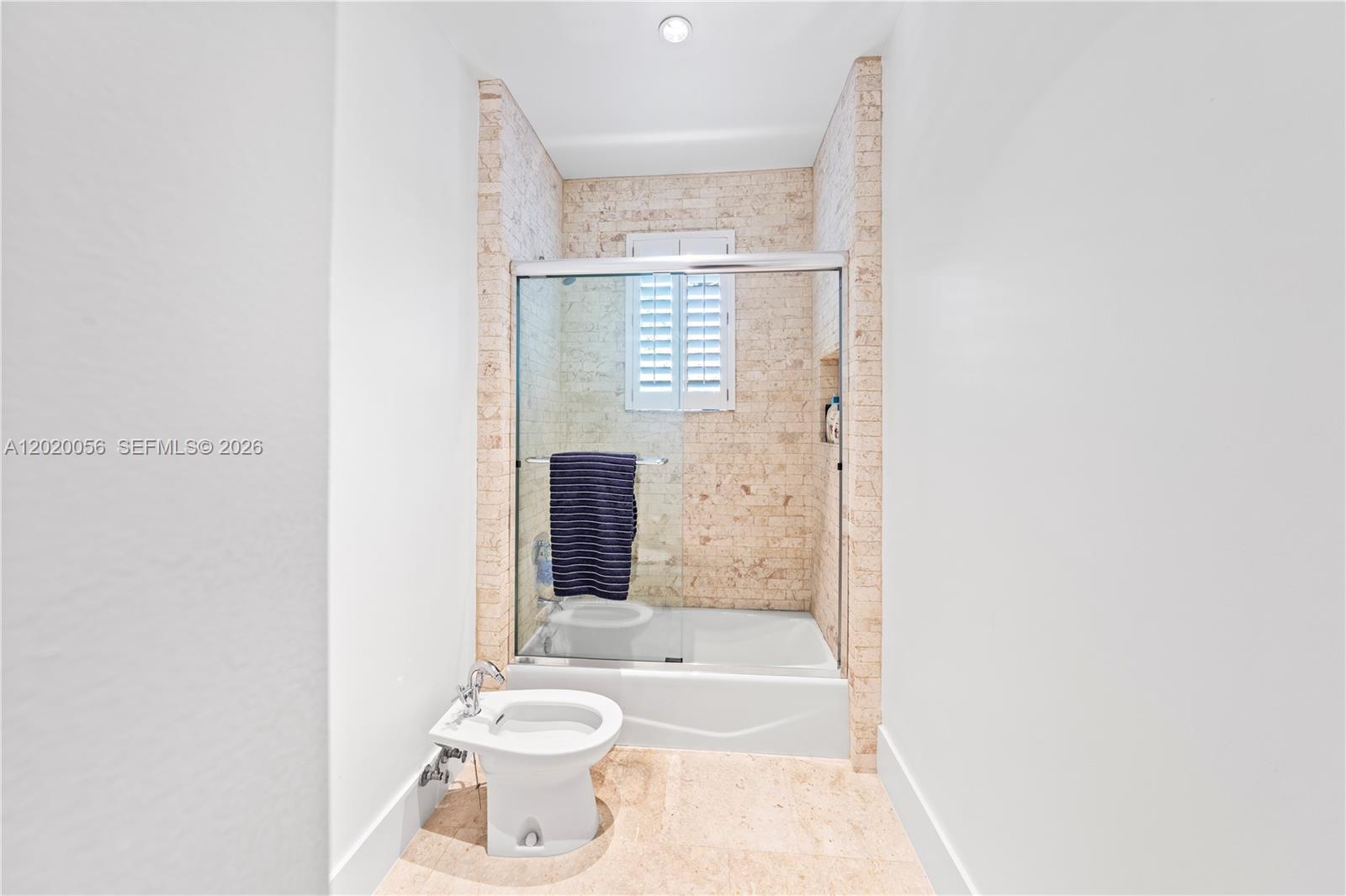 4196 Douglas Road Miami, FL 33133 - Photo 69 of 96 a bathroom with a bathtub sink and toilet