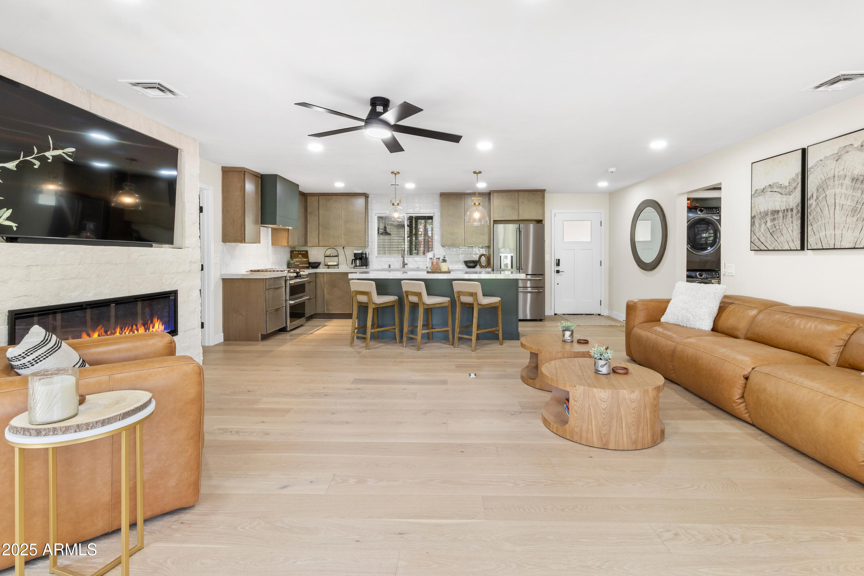 7451 Buck Springs Road Pinetop, AZ 85935 - Photo 12 of 35 a living room with furniture kitchen and a flat screen tv