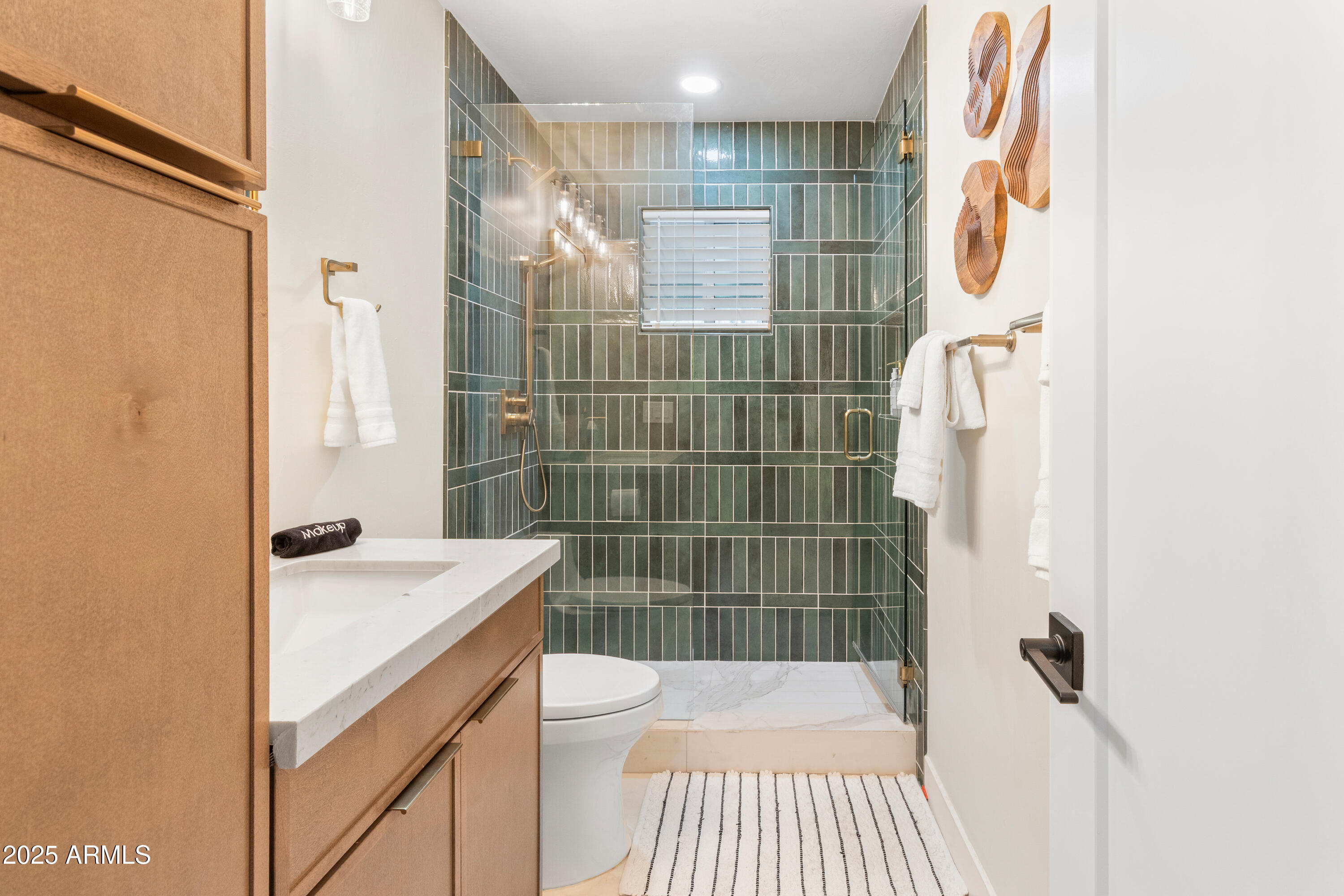 7451 Buck Springs Road Pinetop, AZ 85935 - Photo 16 of 35 a bathroom with a sink toilet and shower