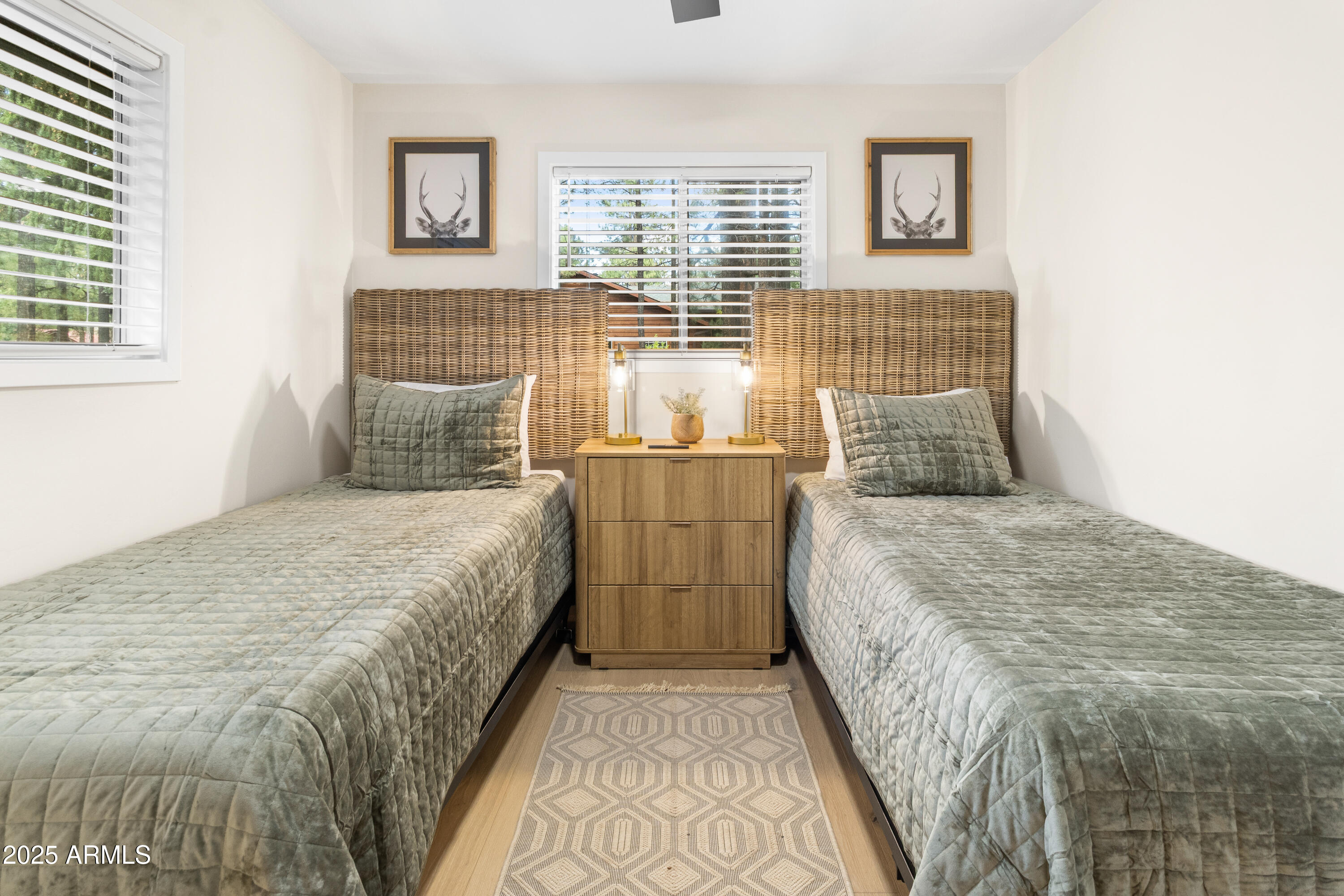7451 Buck Springs Road Pinetop, AZ 85935 - Photo 20 of 35 a bedroom with a bed and wooden floor