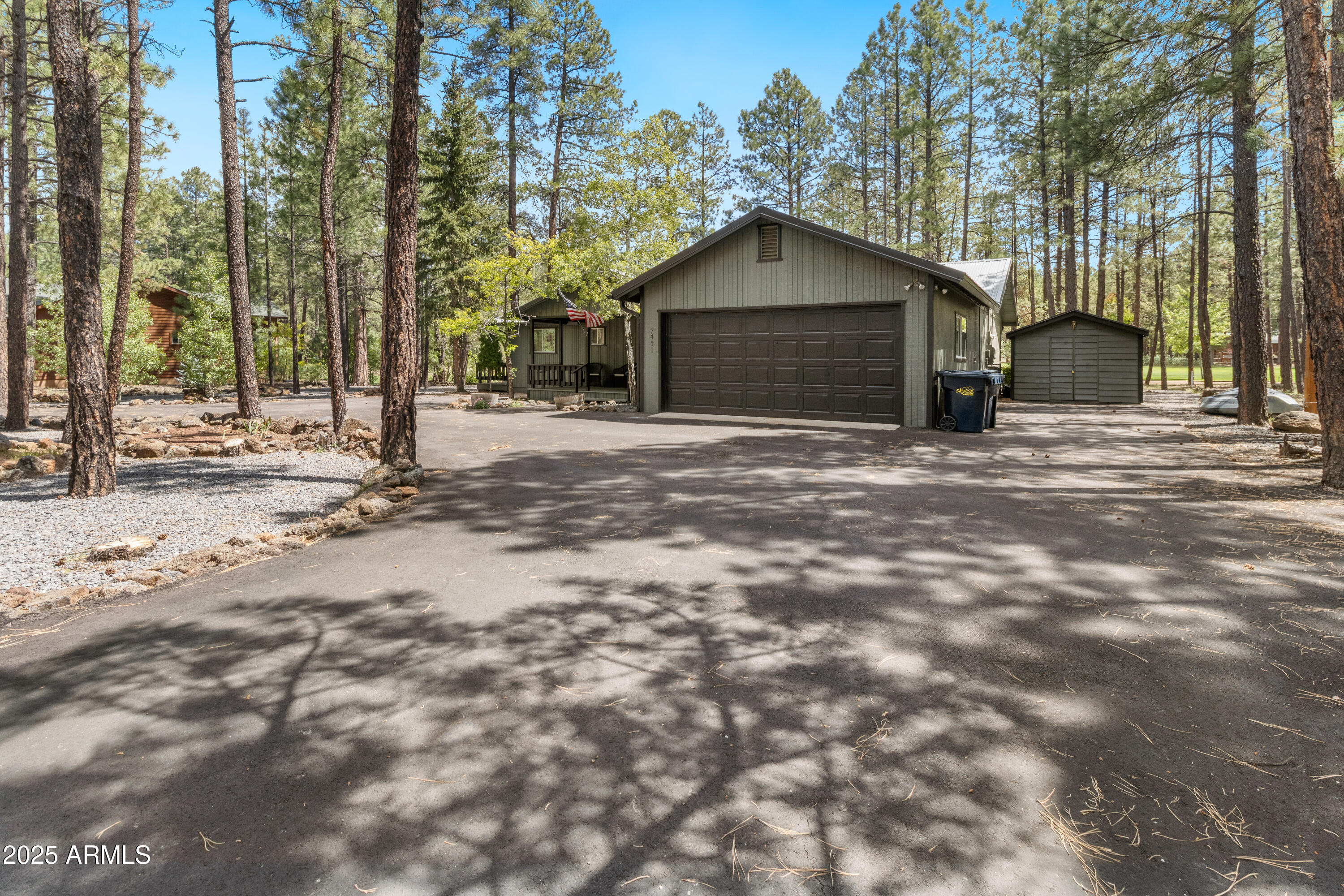 7451 Buck Springs Road Pinetop, AZ 85935 - Photo 2 of 35 a house with trees in the background