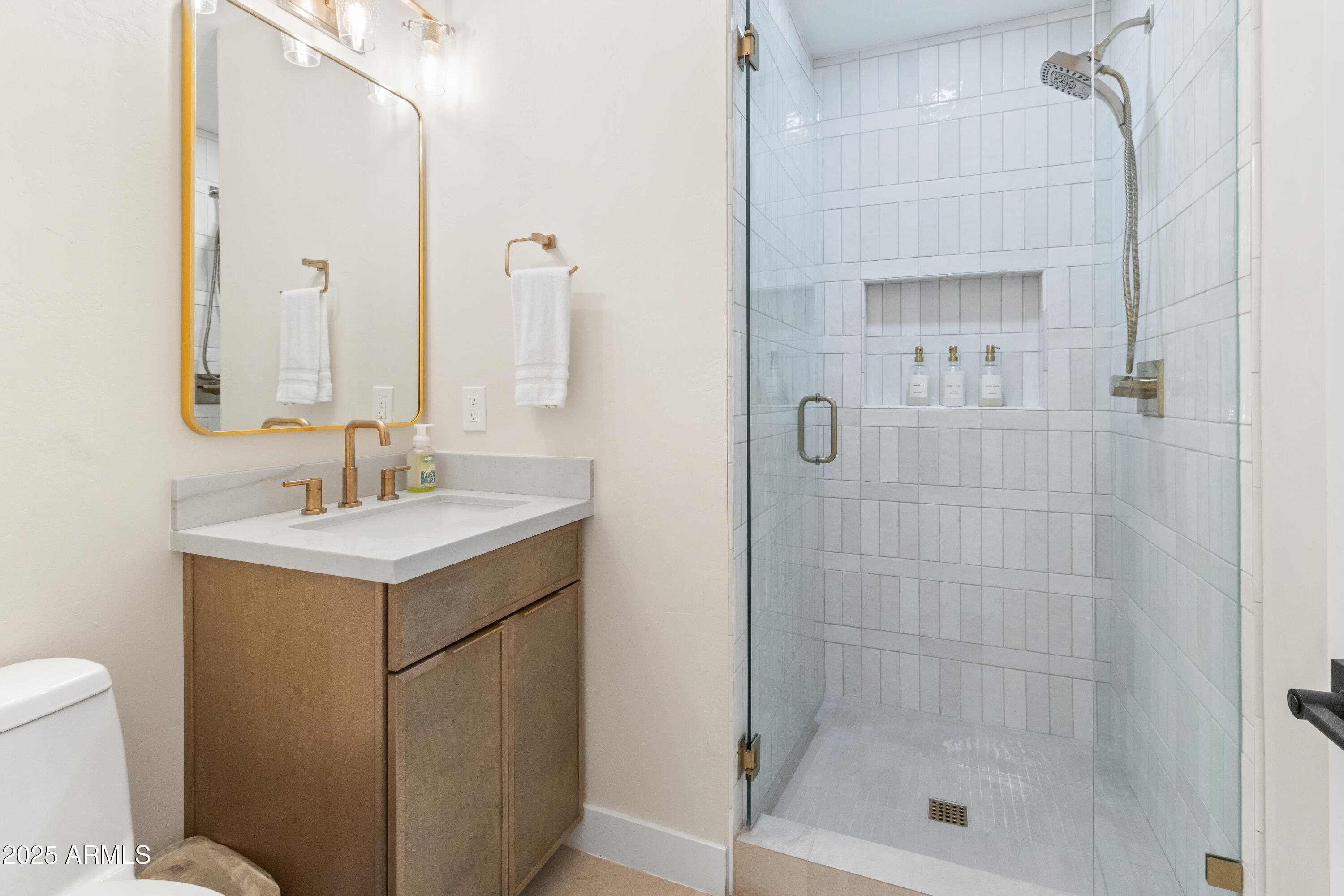 7451 Buck Springs Road Pinetop, AZ 85935 - Photo 22 of 35 a bathroom with a sink a toilet and shower