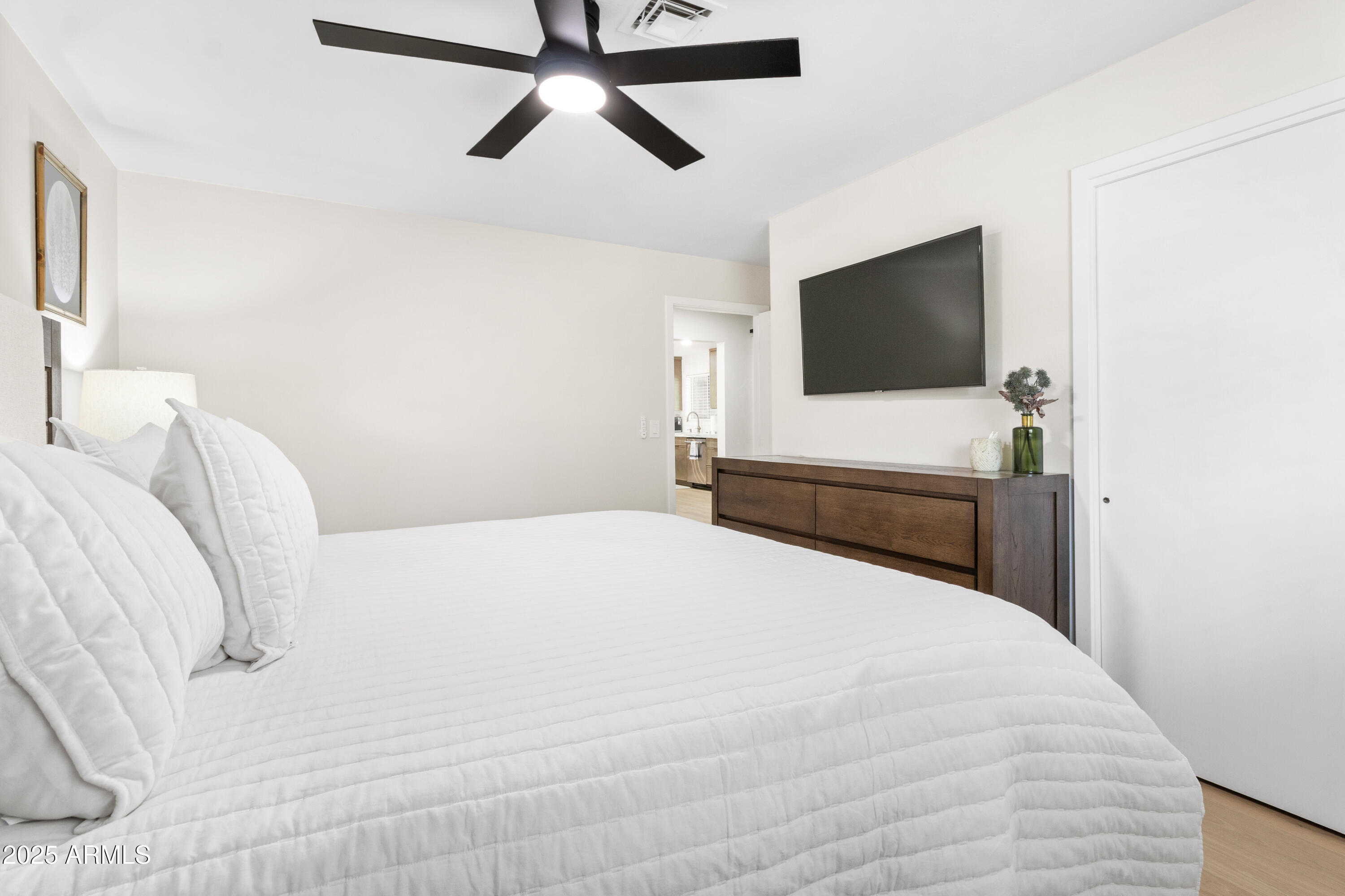 7451 Buck Springs Road Pinetop, AZ 85935 - Photo 24 of 35 a bedroom with a bed and a flat screen tv