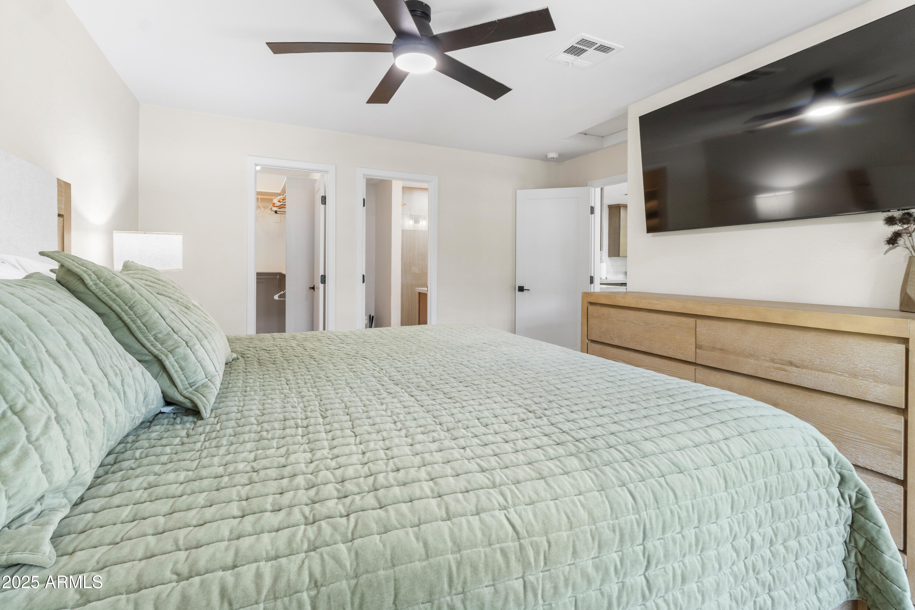 7451 Buck Springs Road Pinetop, AZ 85935 - Photo 25 of 35 a bedroom with a bed and a flat screen tv